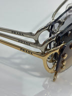 Metal eyeglasses frames with PRADA engraved on temples, gold and silver tone