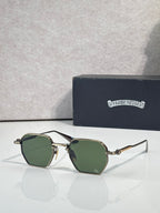 Chrome sunglasses with green lenses and gold-toned frame, front view