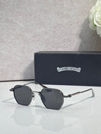 Chrome sunglasses with dark lenses and silver frame, side angle