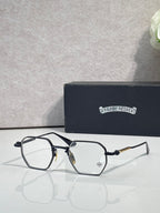 Black rectangular eyeglasses with clear lenses, gold-tone hinge details