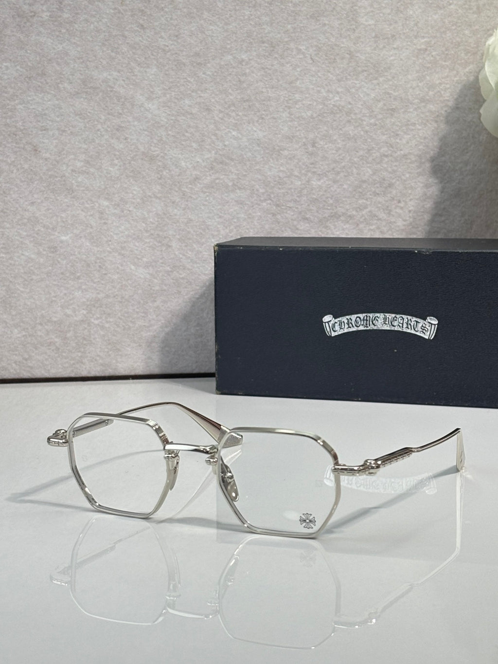 Silver rectangular eyeglasses with clear lenses and slim metal temple arms
