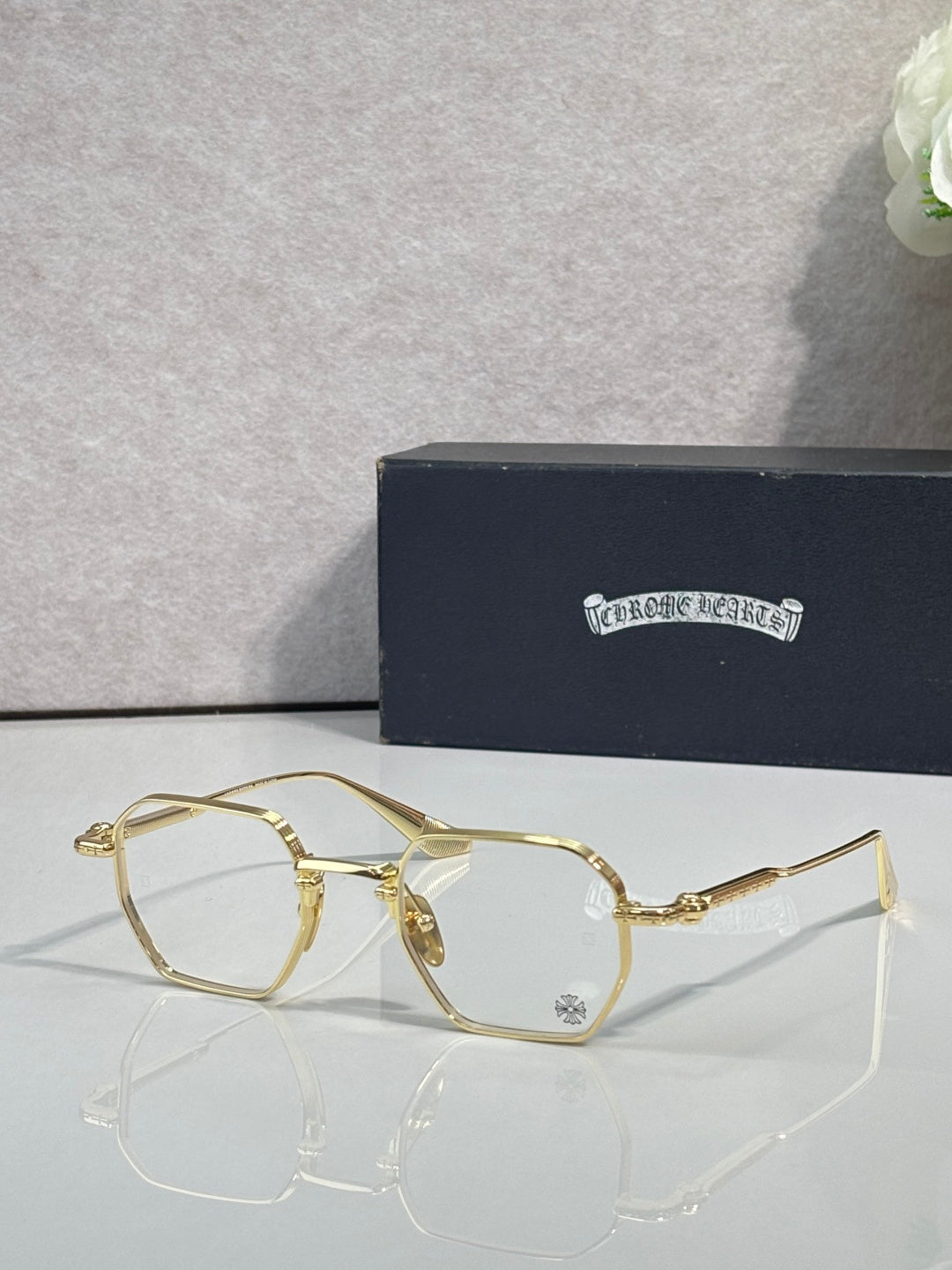 Gold-tone rectangular eyeglasses with clear lenses and slim metal temple arms