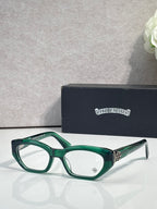 Chrome glasses with green frame, round-square clear lenses, and metal side accents.