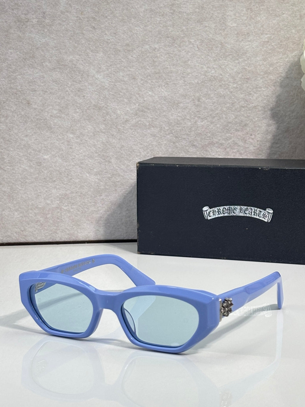 Blue and light blue glasses with pale blue lenses and metal temples