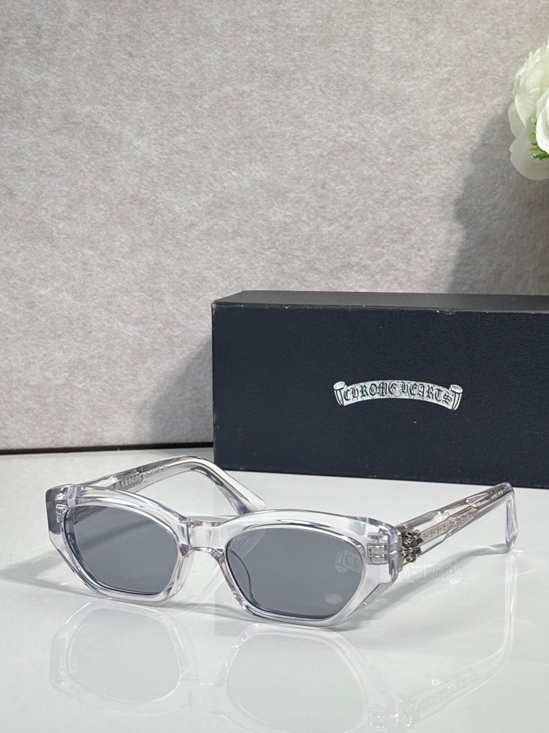 Clear and chrome glasses with gray lenses and straight metal temples
