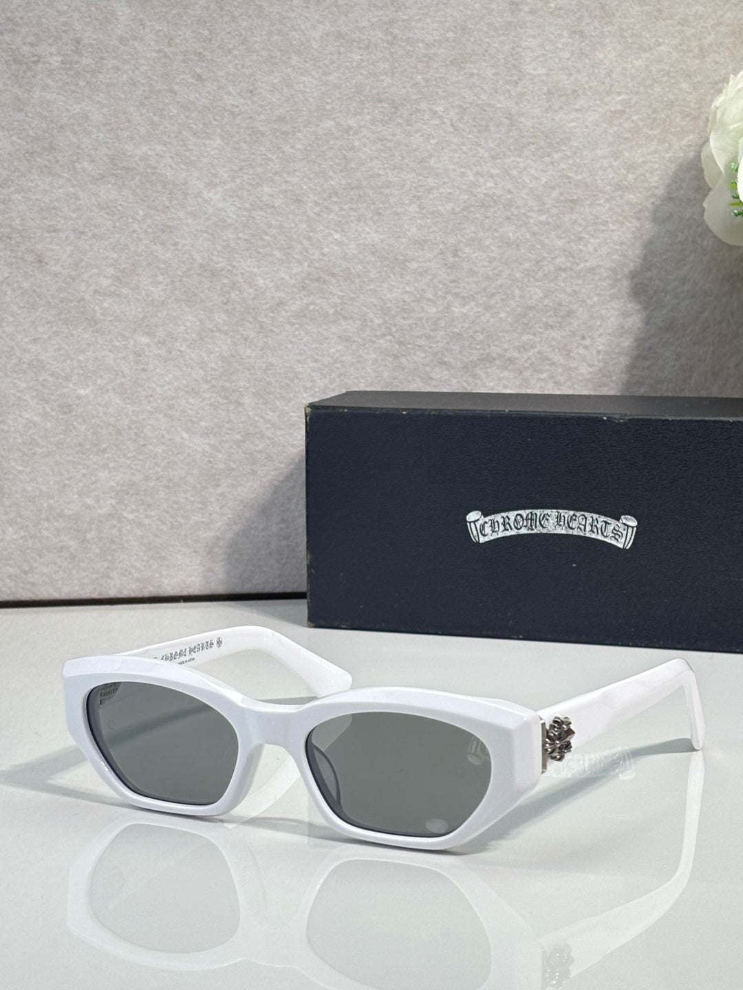 White and clear glasses with gray lenses and metal temples