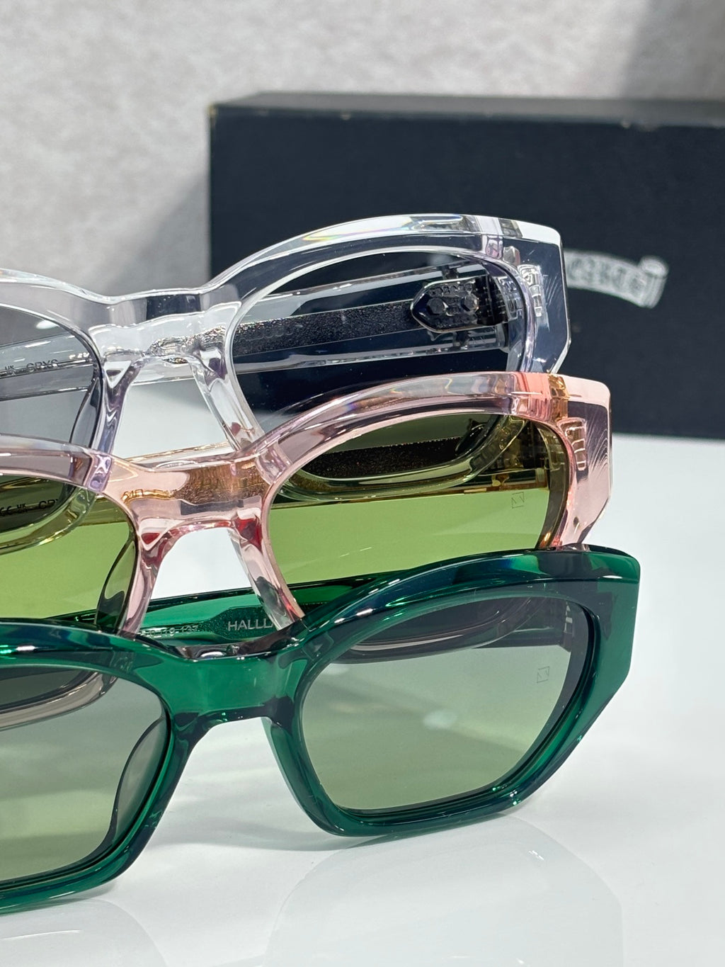 Layered green and clear glasses frames with round lenses and chrome arms
