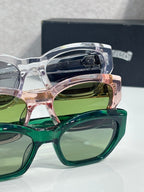 Layered green and clear glasses frames with round lenses and chrome arms