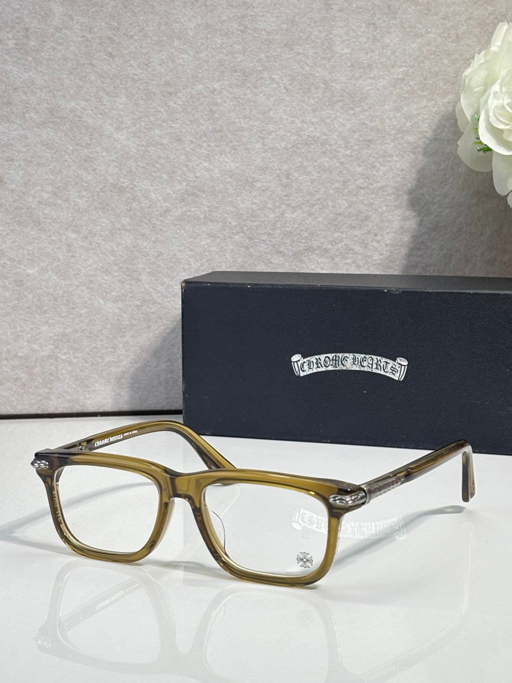 Chrome eyeglasses with olive-gold frame and clear lenses, metal temple tips