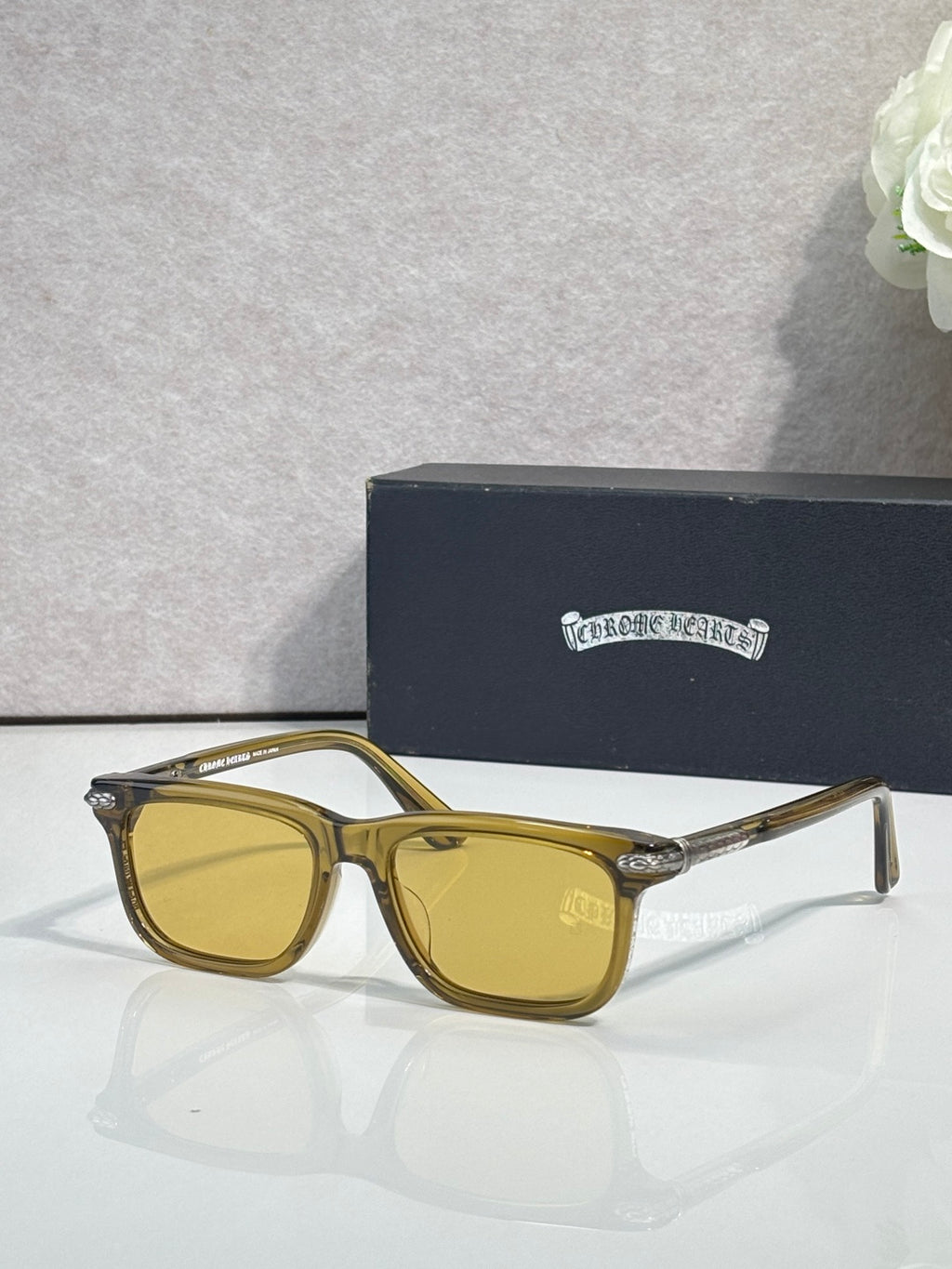 Gold-toned eyeglasses with yellow lenses and rectangular frames