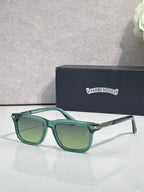 Teal eyeglasses with green-tinted lenses and rectangular frames