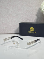 Versace glasses with clear lenses, dark frame, gold and silver geometric temple detail
