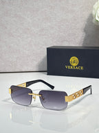 Black-frame sunglasses with light purple tinted lenses and gold bar detail