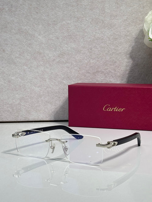 Cartier glasses with clear lenses, gold frame, and blue-accent temples