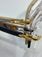 Cartier glasses close-up: blue and gold temple with silver hinge hardware