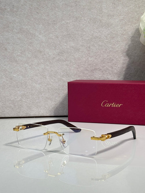 Cartier glasses with clear lenses and gold metal frame, dark blue temple tips