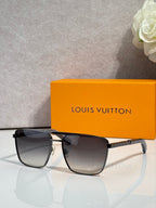 Louis Vuitton sunglasses with dark lenses and black frame with gold-tone accents