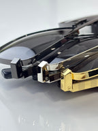 Louis Vuitton sunglasses close-up of gold and black temple hardware