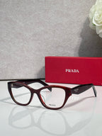 Prada burgundy-brown full-rim eyeglasses with clear lenses and wide acetate frame
