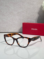 Prada tortoise-brown full-rim eyeglasses with clear lenses and glossy acetate frame