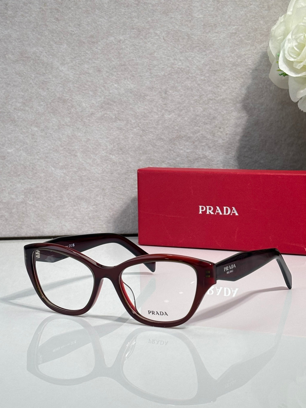 Prada dark tortoise full-rim eyeglasses with clear lenses and PRADA temple branding