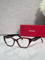 Prada dark tortoise full-rim eyeglasses with clear lenses and PRADA temple branding