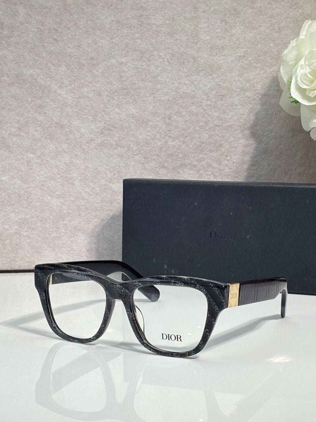 Black eyeglass frame with clear lenses and DIOR logo on temple