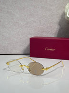 Cartier round sunglasses with gold frame and gray tinted lenses