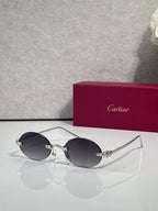 Cartier round sunglasses with silver frame and dark tinted lenses