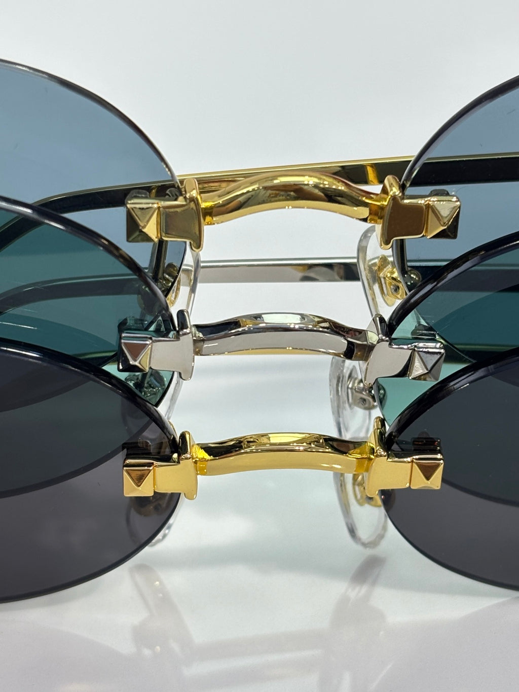 Cartier sunglasses close-up of gold stud hinge and tinted lenses