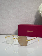 Gold metal-frame glasses with brown tinted lenses and decorative bridge detail