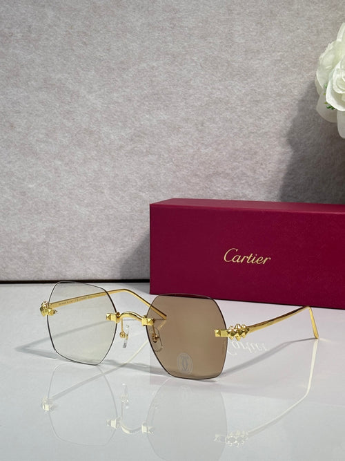 Gold metal-frame glasses with brown tinted lenses and decorative bridge detail