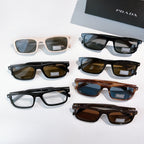 Prada eyeglasses and sunglasses assortment: cream, black, and tortoiseshell frames with lenses