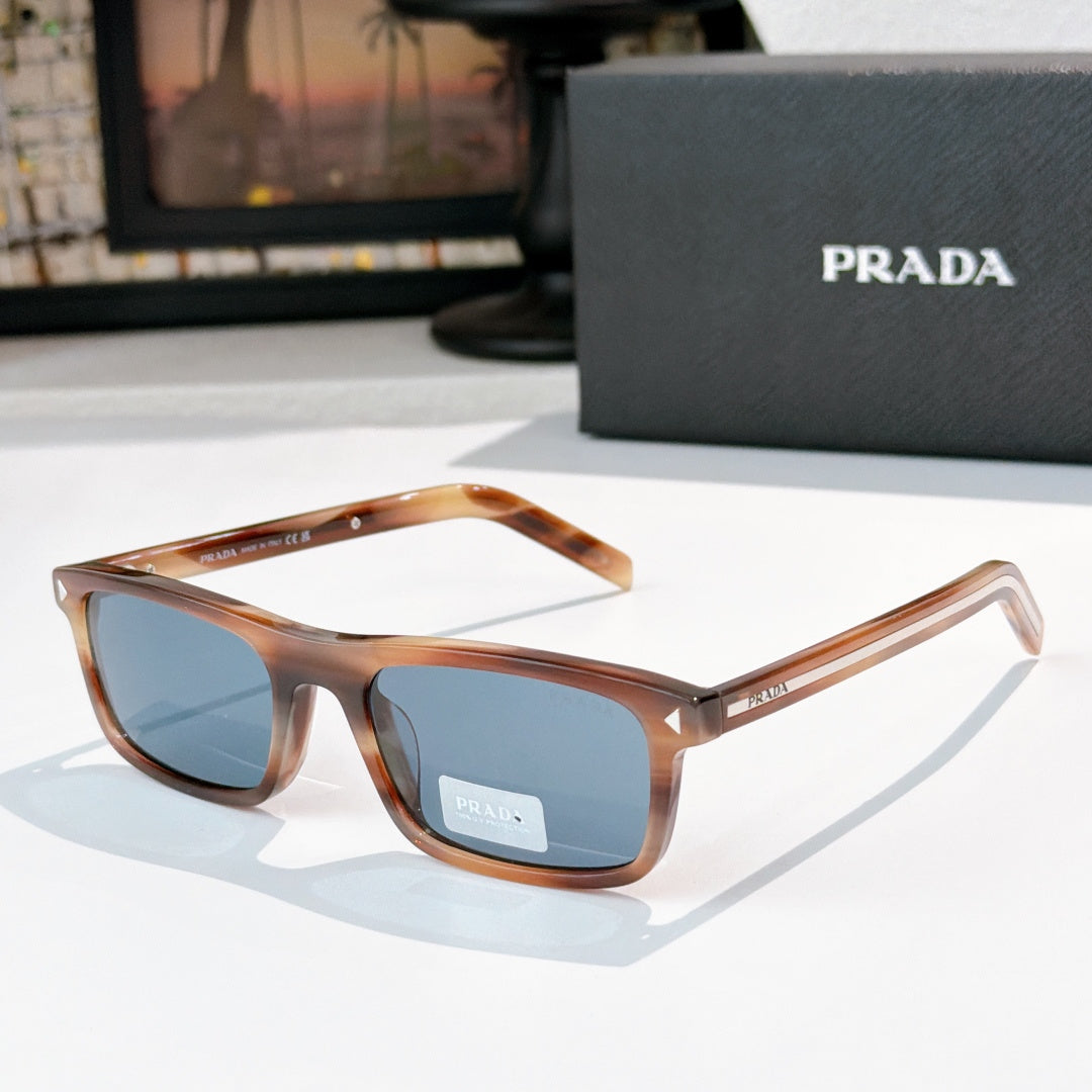 Prada sunglasses with tortoiseshell frame and blue-tinted lenses, metal temples with logo