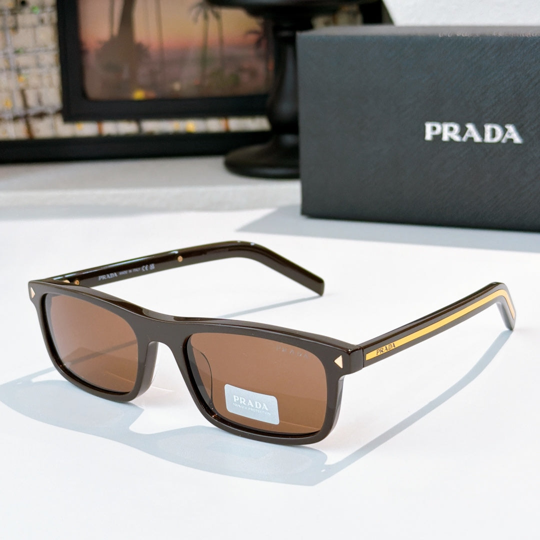 Prada sunglasses with black frame and brown tinted lenses, gold-accent metal temples