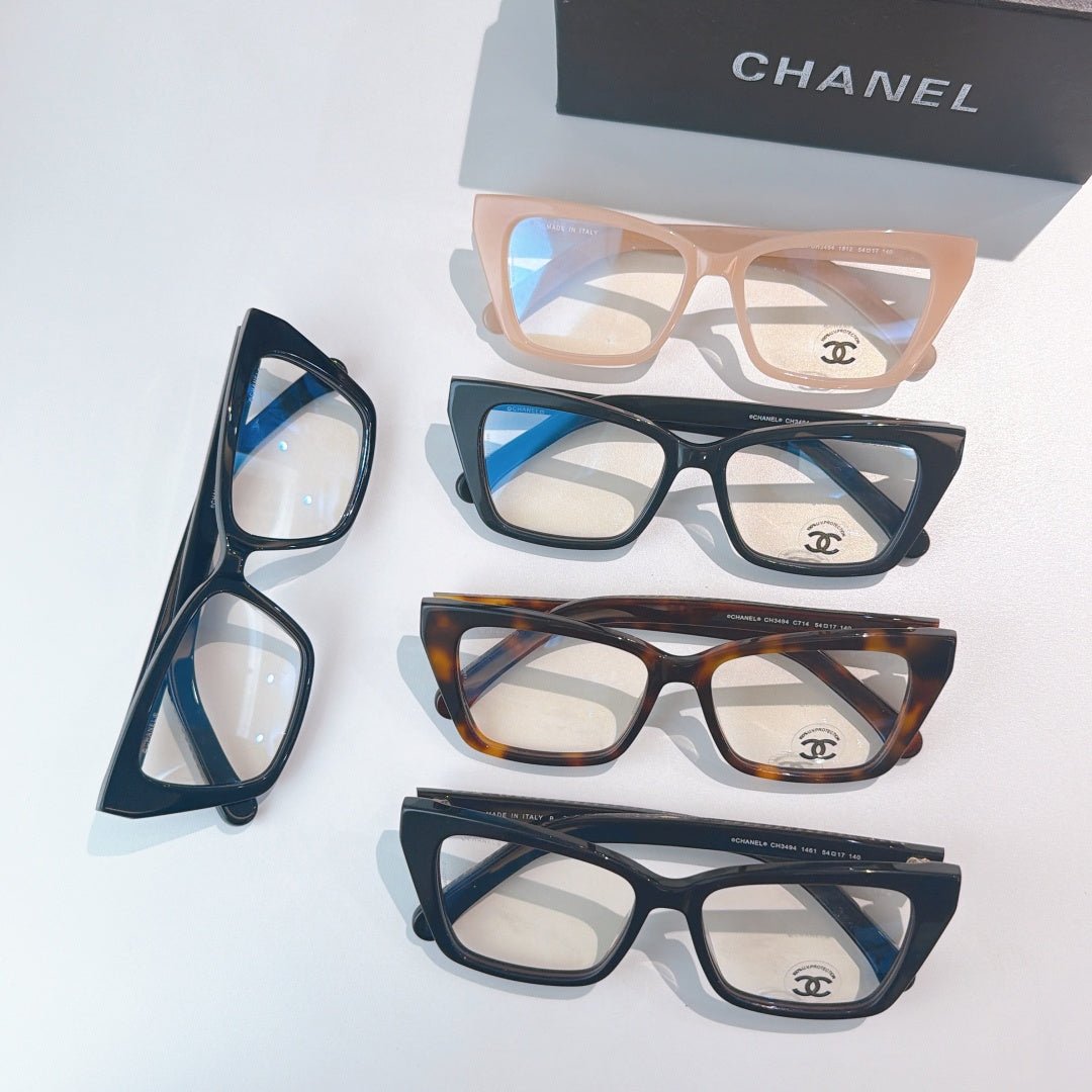 Assorted square eyeglasses with clear lenses in beige, blue, tortoiseshell, and black