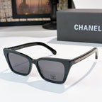 Chanel sunglasses with black frames and smoky dark tinted lenses