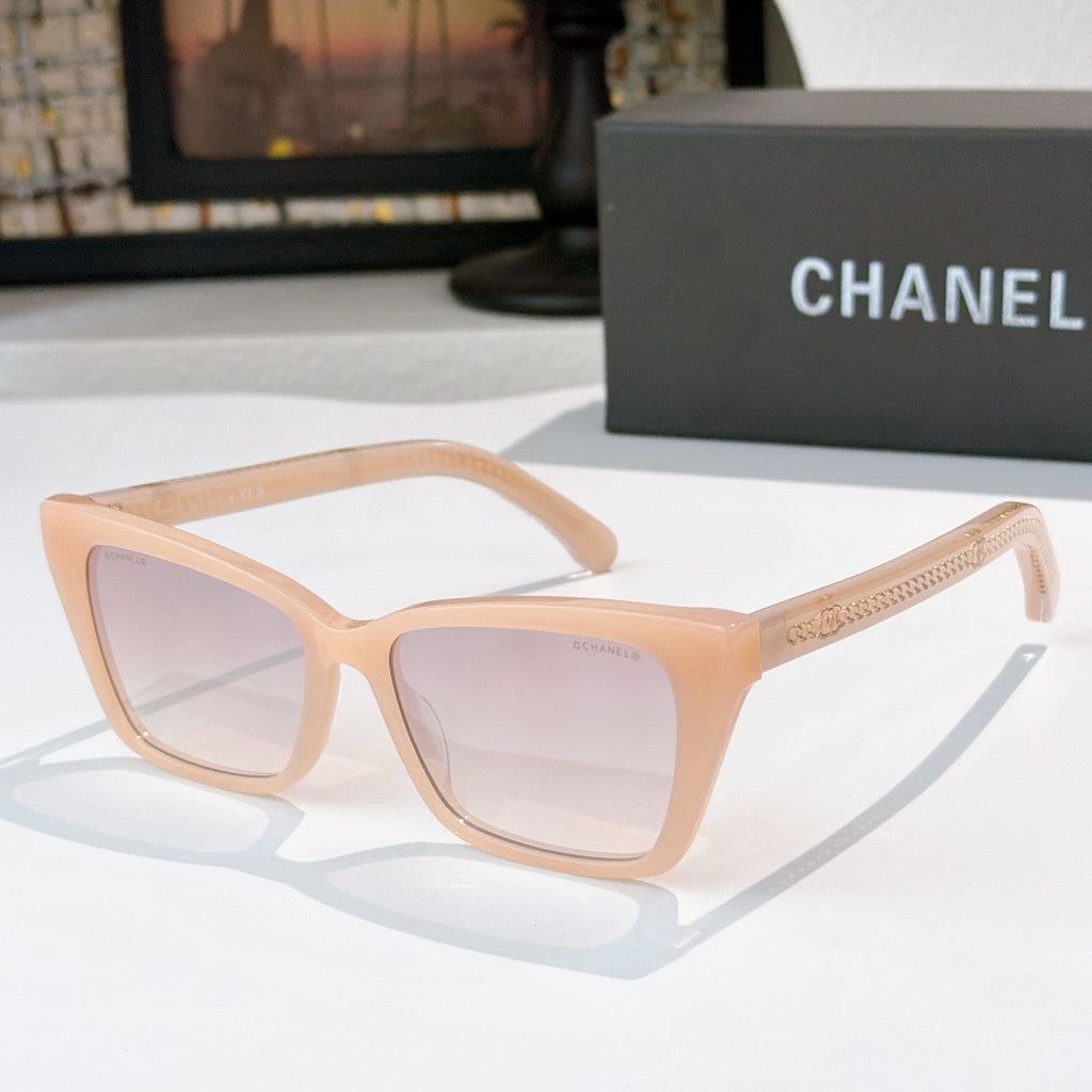 Chanel sunglasses with light peach frames and pale pink tinted lenses