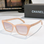 Chanel sunglasses with light peach frames and pale pink tinted lenses