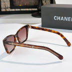 Chanel sunglasses in tortoiseshell with brown lenses and chain-detail temples