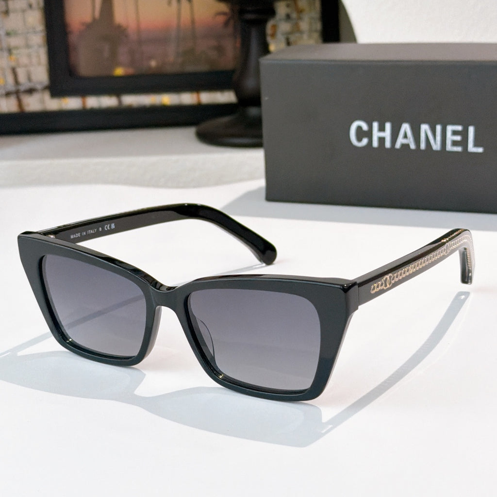 Chanel sunglasses with black frames and dark gray tinted lenses