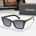 Chanel sunglasses with black frames and dark gray tinted lenses
