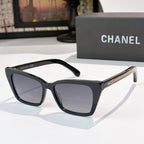 Chanel sunglasses with black frames and dark gray tinted lenses