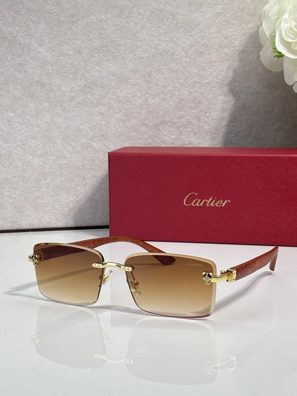 Cartier eyeglasses, brown frame with amber tinted lenses and gold hinge detail