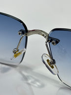 Cartier eyeglasses close-up, blue lenses with black frame and gold-silver hinge