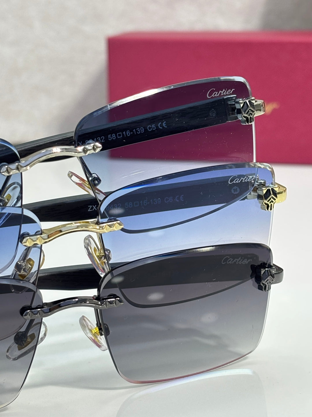 Cartier eyeglasses side view, blue lenses and gold hinge on dark frame