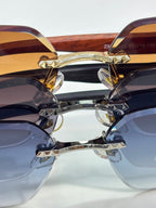 Cartier sunglasses front close-up showing layered blue and brown gradient lenses
