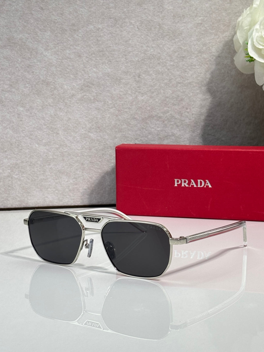 Black sunglasses with rectangular frames and dark lenses