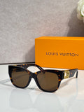 Dark tortoiseshell sunglasses with round lenses and gold LV logo arms