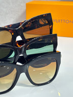Stacked dark tortoiseshell sunglasses with green-blue and neutral lenses
